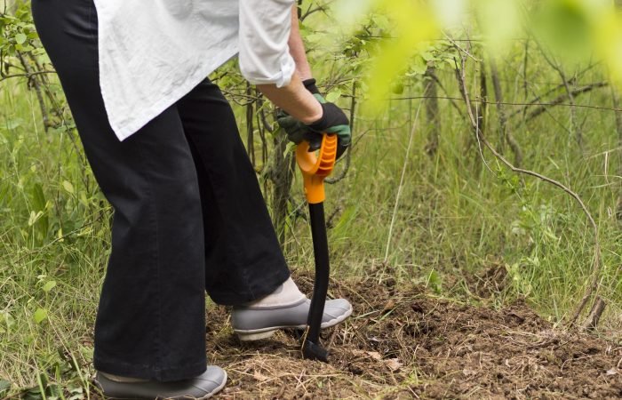 woman-digging-her-garden